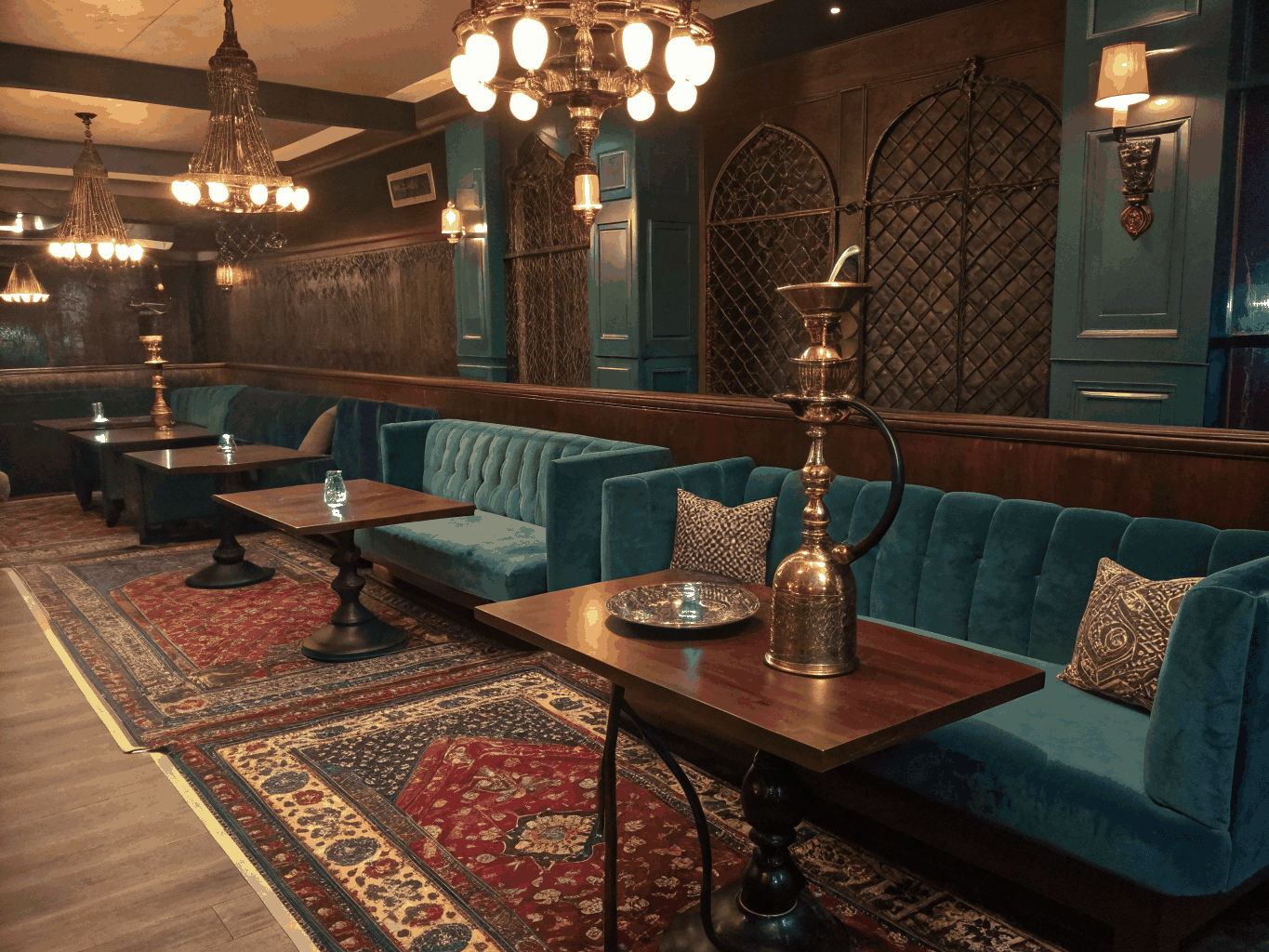 Plush leather and dark wood seating corner inside the NARQILA Yerevan lounge